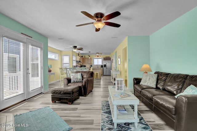 167 Topsail Rd, North Topsail Beach, NC 28460 - living room featuring a ceiling fan and light wood-style flooring