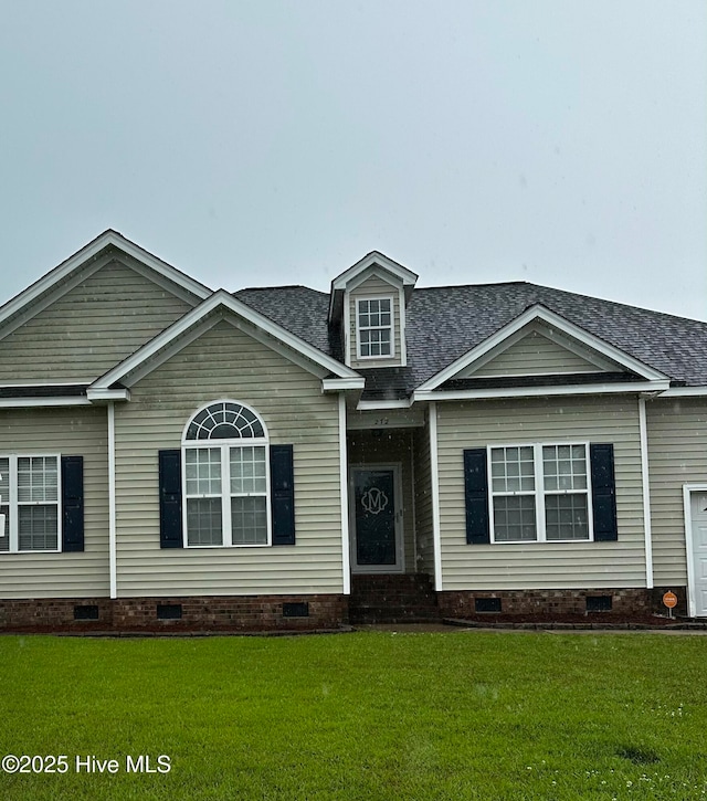 view of front of property with crawl space, a front lawn, and a shingled roof