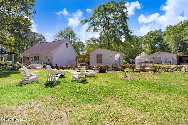 342 Shirley Plantation Dr, Snow Hill, NC 28580 - view of green lawn featuring a greenhouse and an outbuilding