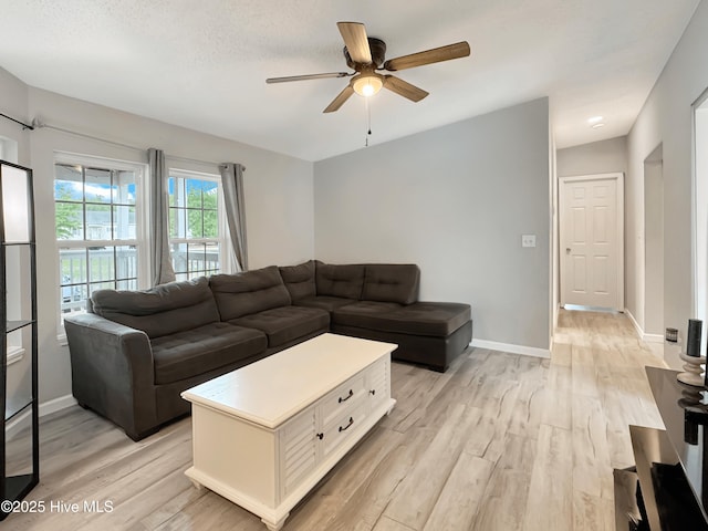 70 Little Pond Rd, Rocky Point, NC 28457 - living room featuring a ceiling fan, light wood-style flooring, and baseboards