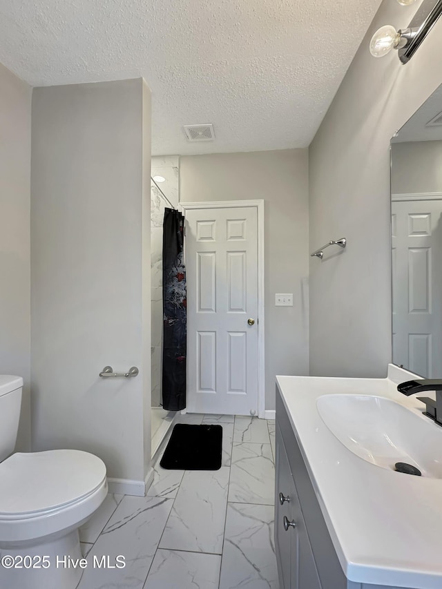 70 Little Pond Rd, Rocky Point, NC 28457 - bathroom with marble look tiles, toilet, a shower stall, baseboards, and vanity