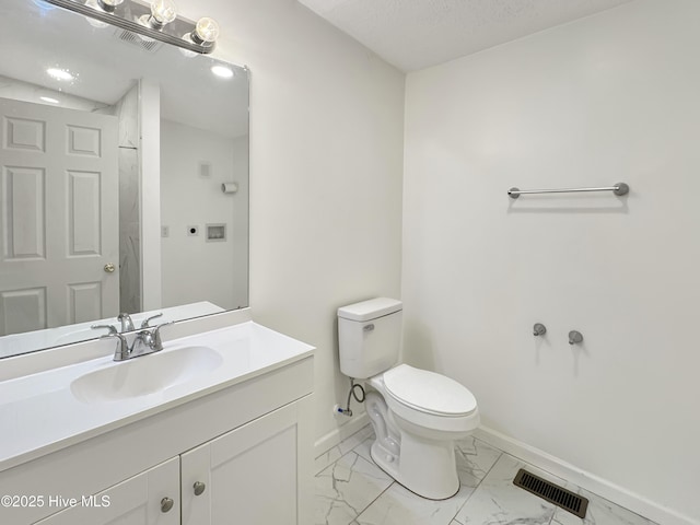70 Little Pond Rd, Rocky Point, NC 28457 - bathroom with marble look tile flooring, toilet, baseboards, and vanity