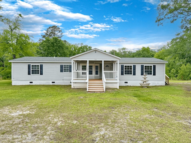 70 Little Pond Rd, Rocky Point, NC 28457 - back of property featuring crawl space, a lawn, a porch, and a shingled roof