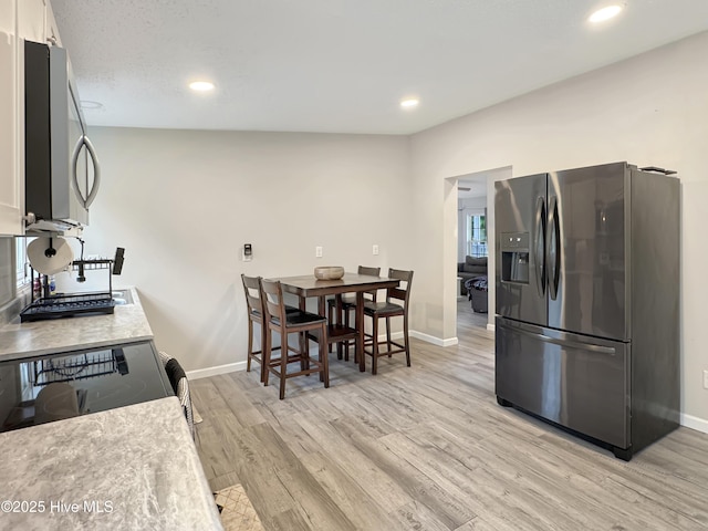 70 Little Pond Rd, Rocky Point, NC 28457 - kitchen with stainless steel appliances, light wood-style floors, baseboards, recessed lighting, and light countertops