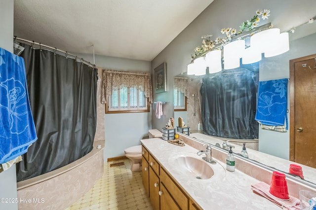 525 Edwards Rd, Jacksonville, NC 28540 - full bathroom featuring vanity, toilet, and shower / tub combo with curtain