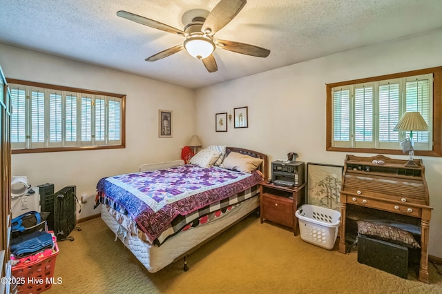 525 Edwards Rd, Jacksonville, NC 28540 - bedroom with multiple windows, carpet flooring, a textured ceiling, and a ceiling fan