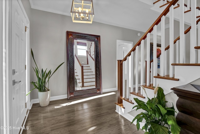 1855 Newkirk Rd, Wilmington, NC 28409 - entryway featuring stairs, a chandelier, wood finished floors, and baseboards