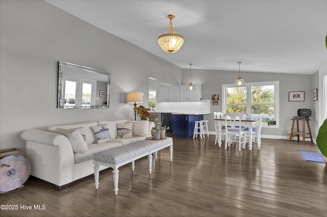 1855 Newkirk Rd, Wilmington, NC 28409 - living room with vaulted ceiling, dark wood-style floors, and baseboards