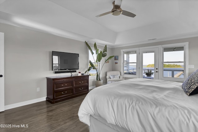 1855 Newkirk Rd, Wilmington, NC 28409 - bedroom featuring access to outside, ornamental molding, dark wood-style floors, baseboards, and a raised ceiling