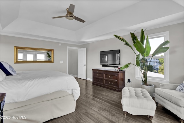 1855 Newkirk Rd, Wilmington, NC 28409 - bedroom with a tray ceiling, dark wood-type flooring, ornamental molding, baseboards, and ceiling fan