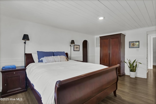 1855 Newkirk Rd, Wilmington, NC 28409 - bedroom with dark wood-type flooring, wood ceiling, arched walkways, and recessed lighting