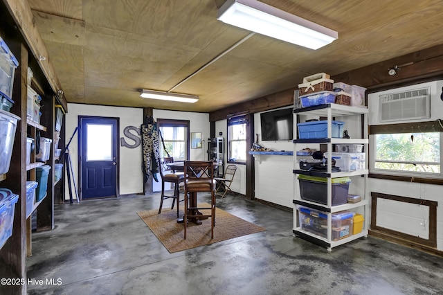 1855 Newkirk Rd, Wilmington, NC 28409 - interior space featuring an AC wall unit and concrete flooring