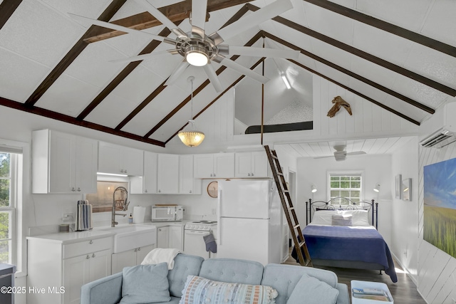 1855 Newkirk Rd, Wilmington, NC 28409 - kitchen featuring a sink, ceiling fan, open floor plan, a wall unit AC, and white appliances