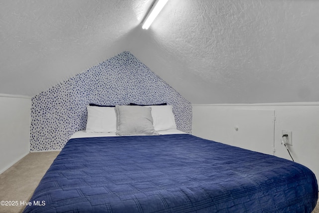 1855 Newkirk Rd, Wilmington, NC 28409 - bedroom featuring a textured ceiling, vaulted ceiling, and carpet floors