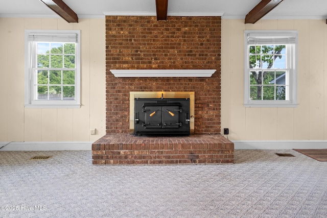 330 Breckenridge Dr, Wilmington, NC 28412 - unfurnished living room with carpet floors, beamed ceiling, baseboards, and a wood stove