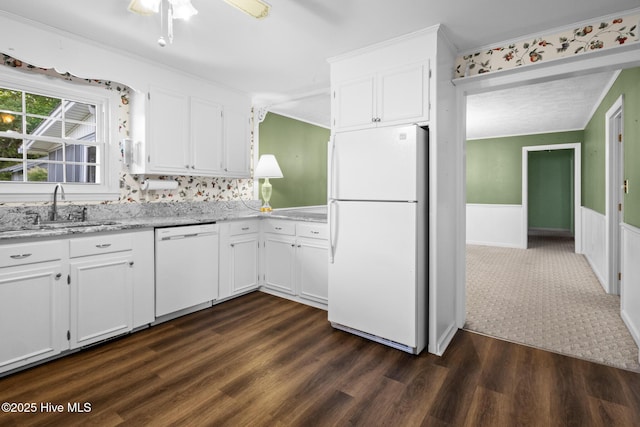 330 Breckenridge Dr, Wilmington, NC 28412 - kitchen featuring white appliances, a sink, white cabinets, a wainscoted wall, and ornamental molding