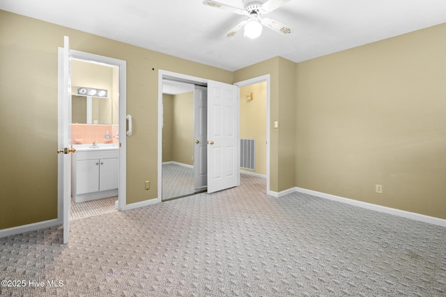330 Breckenridge Dr, Wilmington, NC 28412 - unfurnished bedroom with light carpet, baseboards, ensuite bath, a sink, and a closet