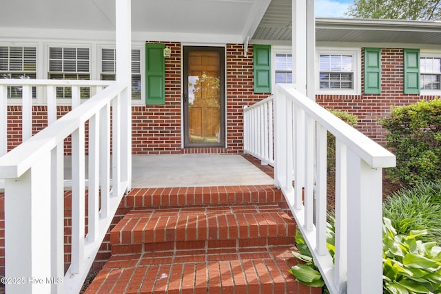 330 Breckenridge Dr, Wilmington, NC 28412 - view of exterior entry featuring covered porch and brick siding
