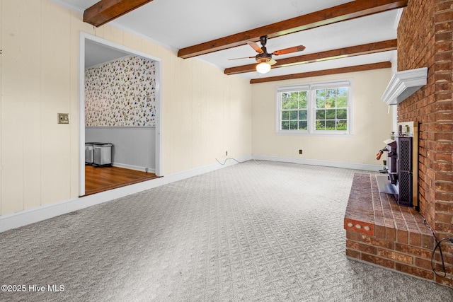 330 Breckenridge Dr, Wilmington, NC 28412 - unfurnished living room with a ceiling fan, beamed ceiling, carpet flooring, and baseboards