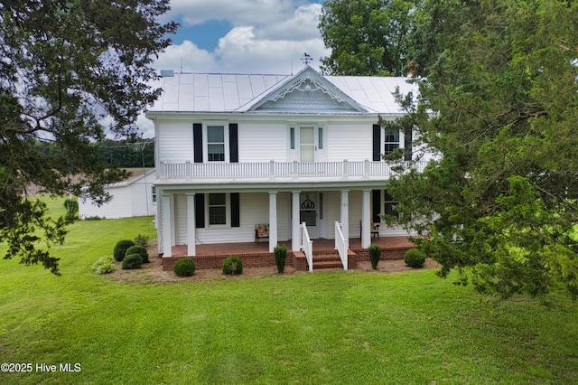 146 Gliden Rd, Hobbsville, NC 27946 - view of front of property with covered porch, a front yard, a balcony, and a standing seam roof