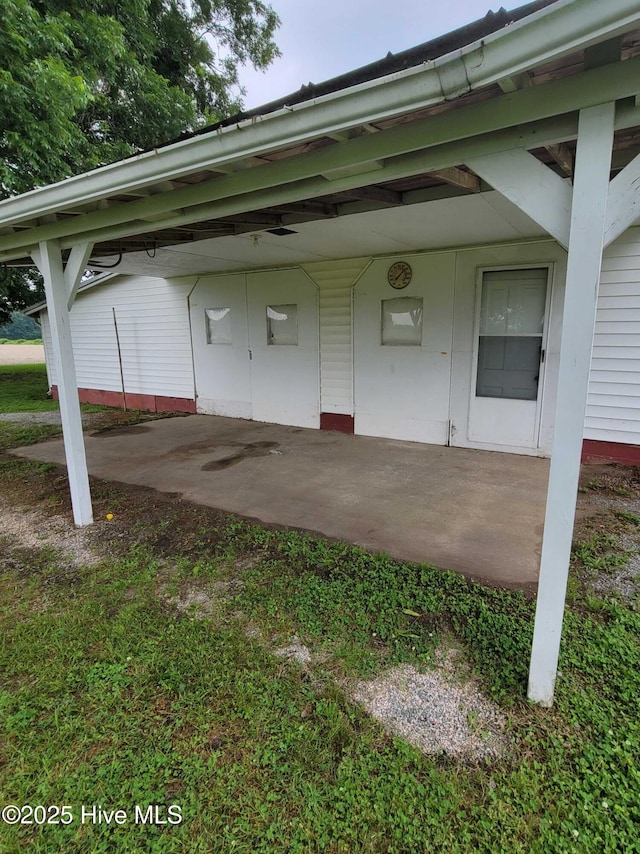 146 Gliden Rd, Hobbsville, NC 27946 - view of vehicle parking featuring an attached carport