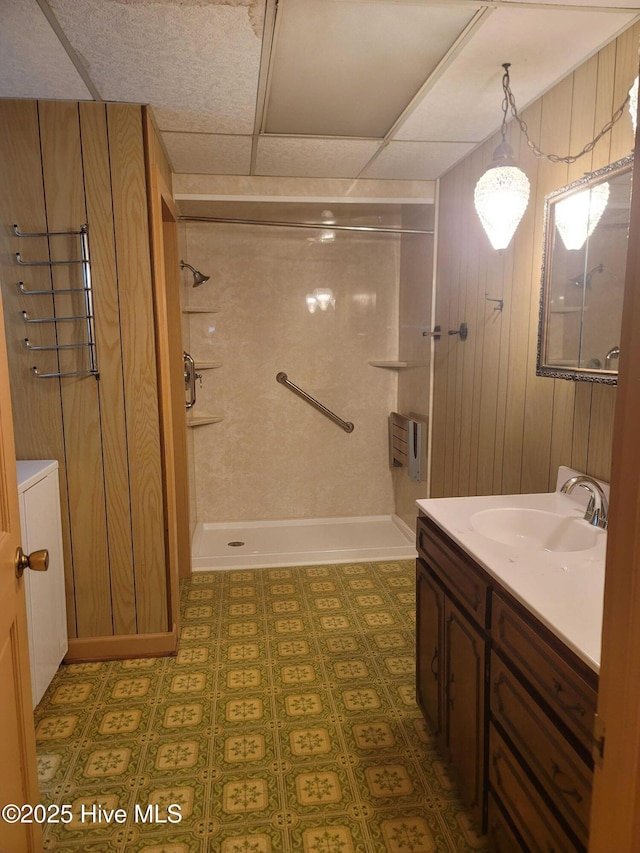 146 Gliden Rd, Hobbsville, NC 27946 - bathroom with a stall shower, vanity, and wooden walls