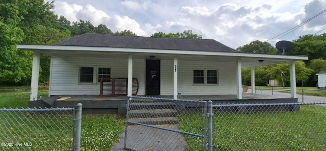 view of front of house with covered porch and an attached carport