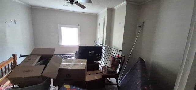 misc room featuring crown molding and a ceiling fan