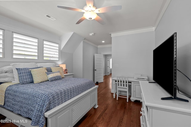 bedroom with crown molding, dark wood-style floors, and a ceiling fan