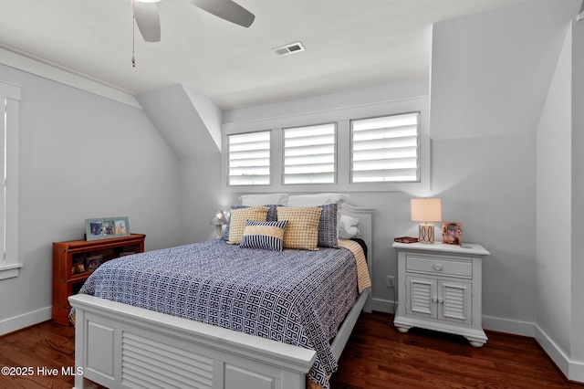 bedroom featuring dark wood-style flooring, baseboards, and a ceiling fan