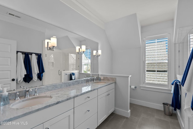 full bathroom featuring a chandelier, baseboards, a shower stall, double vanity, and tile patterned flooring