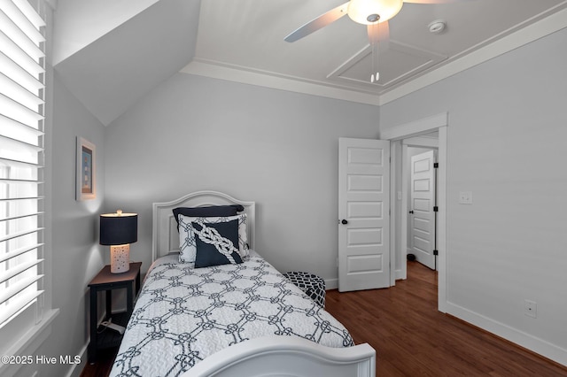 bedroom with wood finished floors, attic access, a ceiling fan, and baseboards