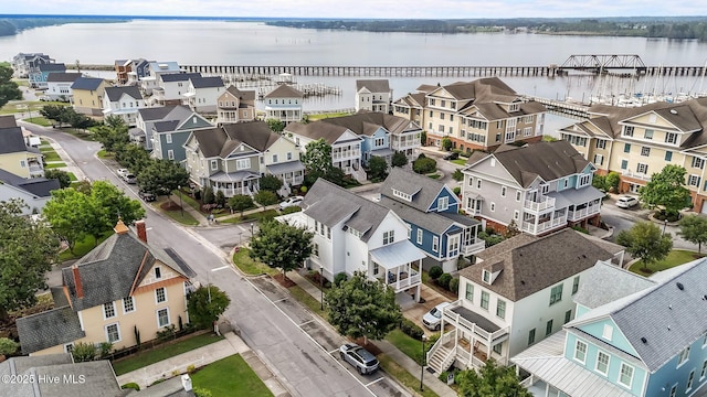 aerial perspective of suburban area featuring a large body of water