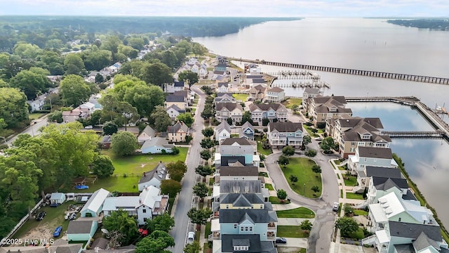aerial perspective of suburban area with a nearby body of water