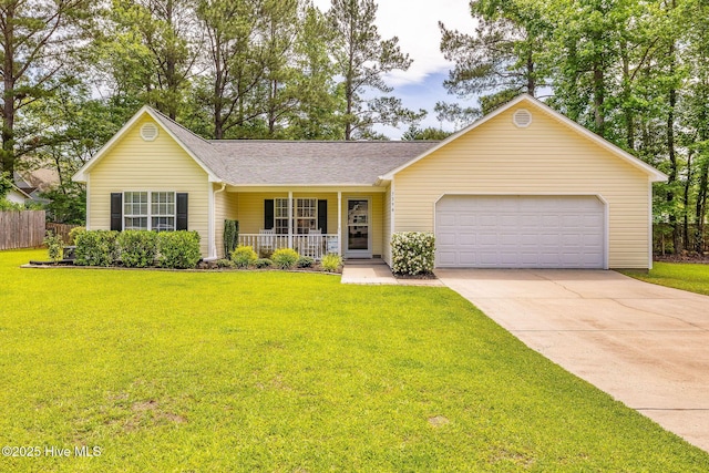 7394 Red Stone Ct, Leland, NC 28451 - view of front of home featuring covered porch, a garage, driveway, and a shingled roof