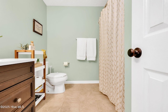 7394 Red Stone Ct, Leland, NC 28451 - bathroom featuring vanity, toilet, tile patterned flooring, and a shower with curtain