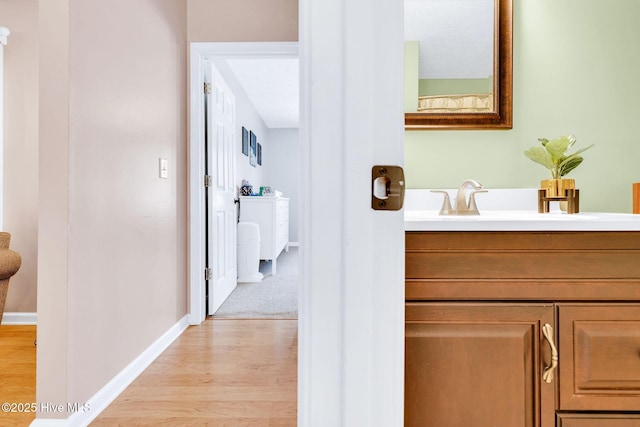 7394 Red Stone Ct, Leland, NC 28451 - corridor featuring light wood-type flooring and baseboards