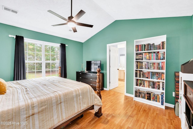 7394 Red Stone Ct, Leland, NC 28451 - bedroom with vaulted ceiling, wood finished floors, baseboards, a ceiling fan, and ensuite bathroom