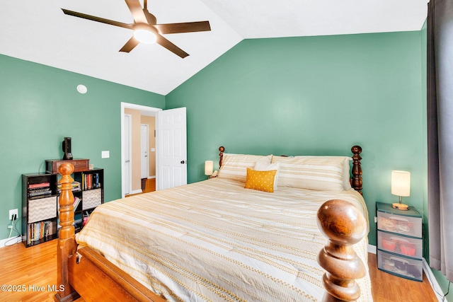 7394 Red Stone Ct, Leland, NC 28451 - bedroom featuring vaulted ceiling, wood finished floors, ceiling fan, and baseboards