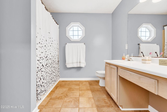 7394 Red Stone Ct, Leland, NC 28451 - bathroom featuring toilet, vanity, and curtained shower