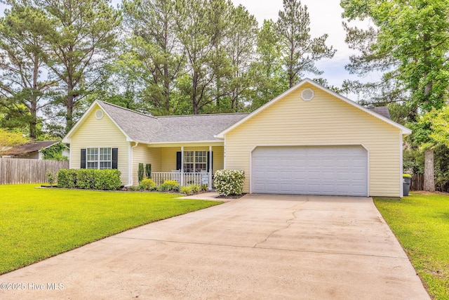 7394 Red Stone Ct, Leland, NC 28451 - view of front of house featuring a porch, concrete driveway, an attached garage, and roof with shingles