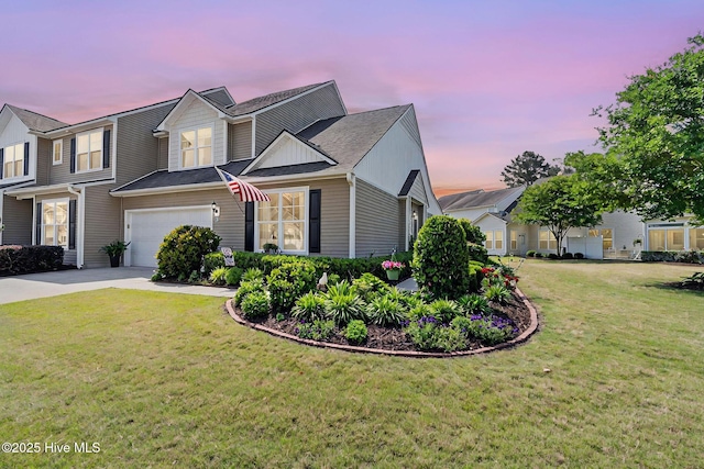 4007 Norseman Loop Unit 5, Southport, NC 28461 - view of front of house featuring driveway, a garage, and a front yard