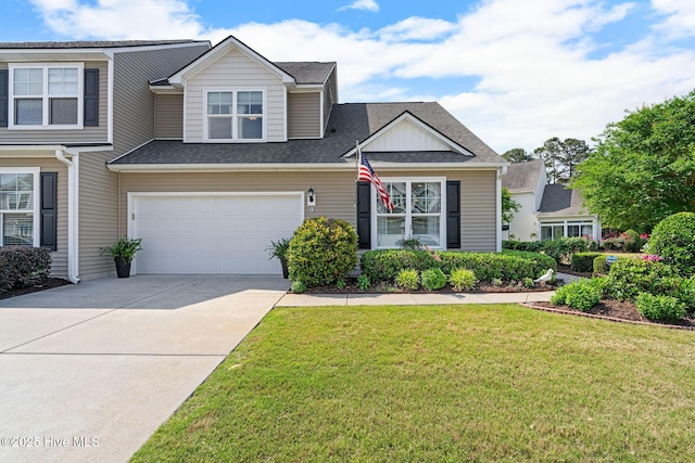 4007 Norseman Loop Unit 5, Southport, NC 28461 - view of front of house featuring an attached garage, concrete driveway, a front lawn, and a shingled roof