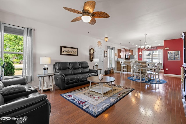 4007 Norseman Loop Unit 5, Southport, NC 28461 - living area with a chandelier, a ceiling fan, dark wood-style floors, and baseboards