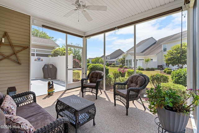 4007 Norseman Loop Unit 5, Southport, NC 28461 - sunroom featuring a ceiling fan, a residential view, and an outdoor hangout area