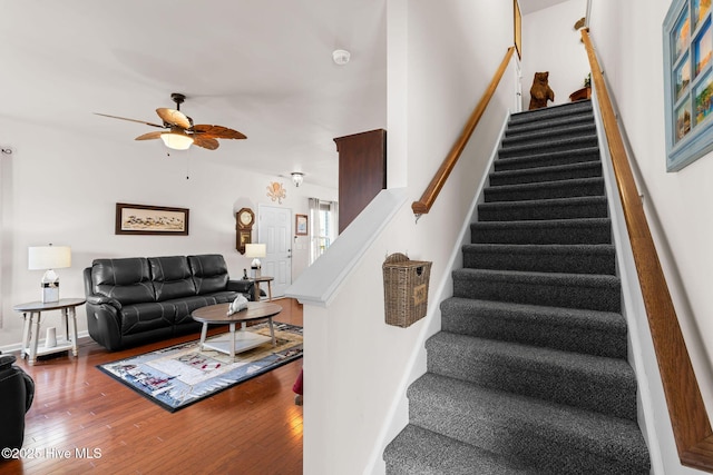 4007 Norseman Loop Unit 5, Southport, NC 28461 - stairs featuring ceiling fan, hardwood / wood-style floors, and baseboards