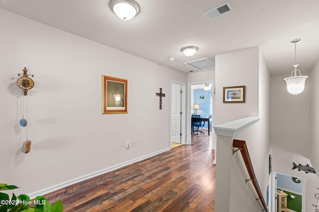4007 Norseman Loop Unit 5, Southport, NC 28461 - corridor featuring an upstairs landing, dark wood-type flooring, baseboards, and attic access