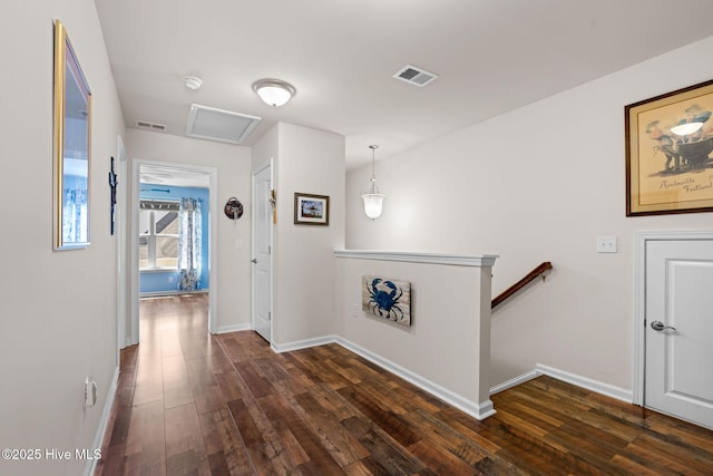 4007 Norseman Loop Unit 5, Southport, NC 28461 - hallway featuring an upstairs landing, dark wood-style floors, and baseboards