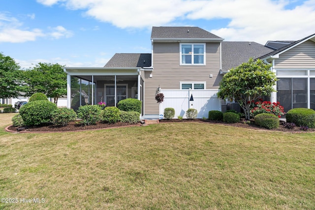 4007 Norseman Loop Unit 5, Southport, NC 28461 - back of property featuring a sunroom and roof with shingles