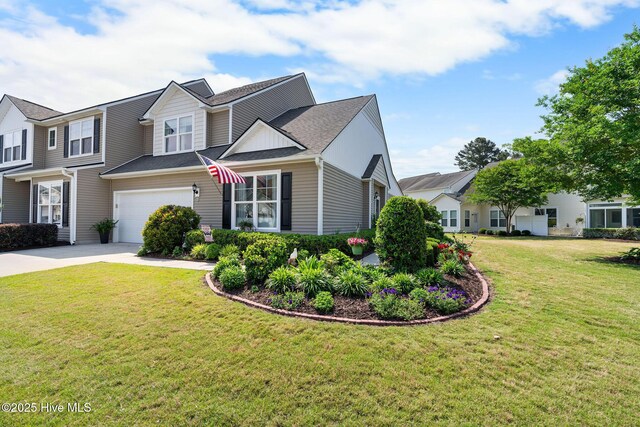 4007 Norseman Loop Unit 5, Southport, NC 28461 - view of front facade with driveway, a garage, and a front yard